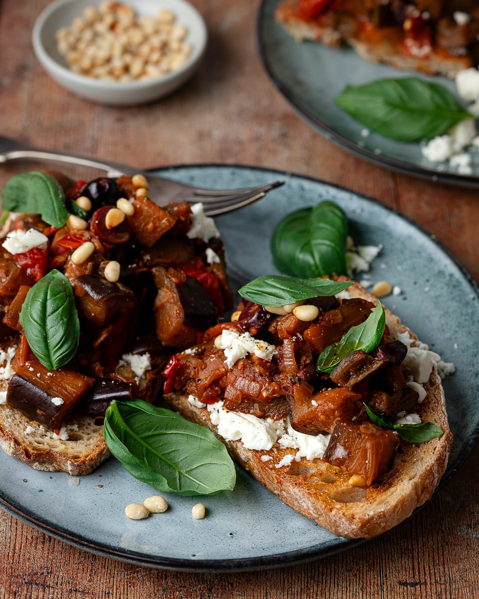 Tomato with aubergine on sourdough bread with basil and feta
