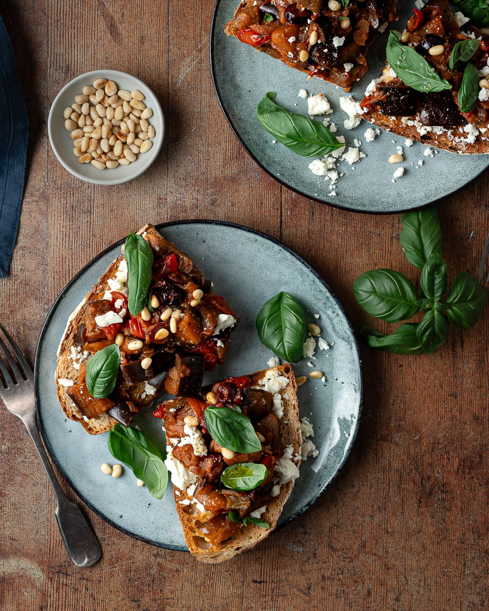 Tomato with aubergine on sourdough bread with basil and feta